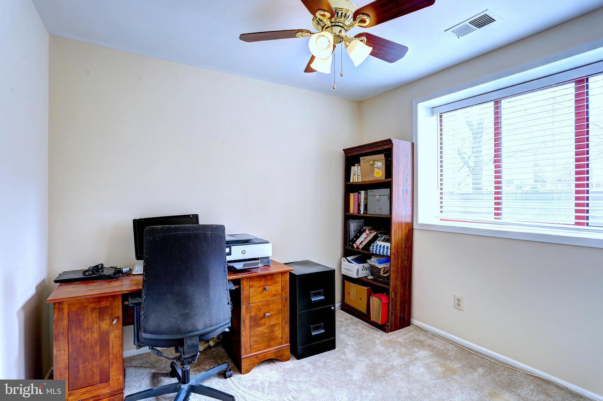 8018 Valley Manor Road, Unit 1A Owings Mills, MD 21117 - Photo 15 of 24 a view of a workspace with furniture and a window