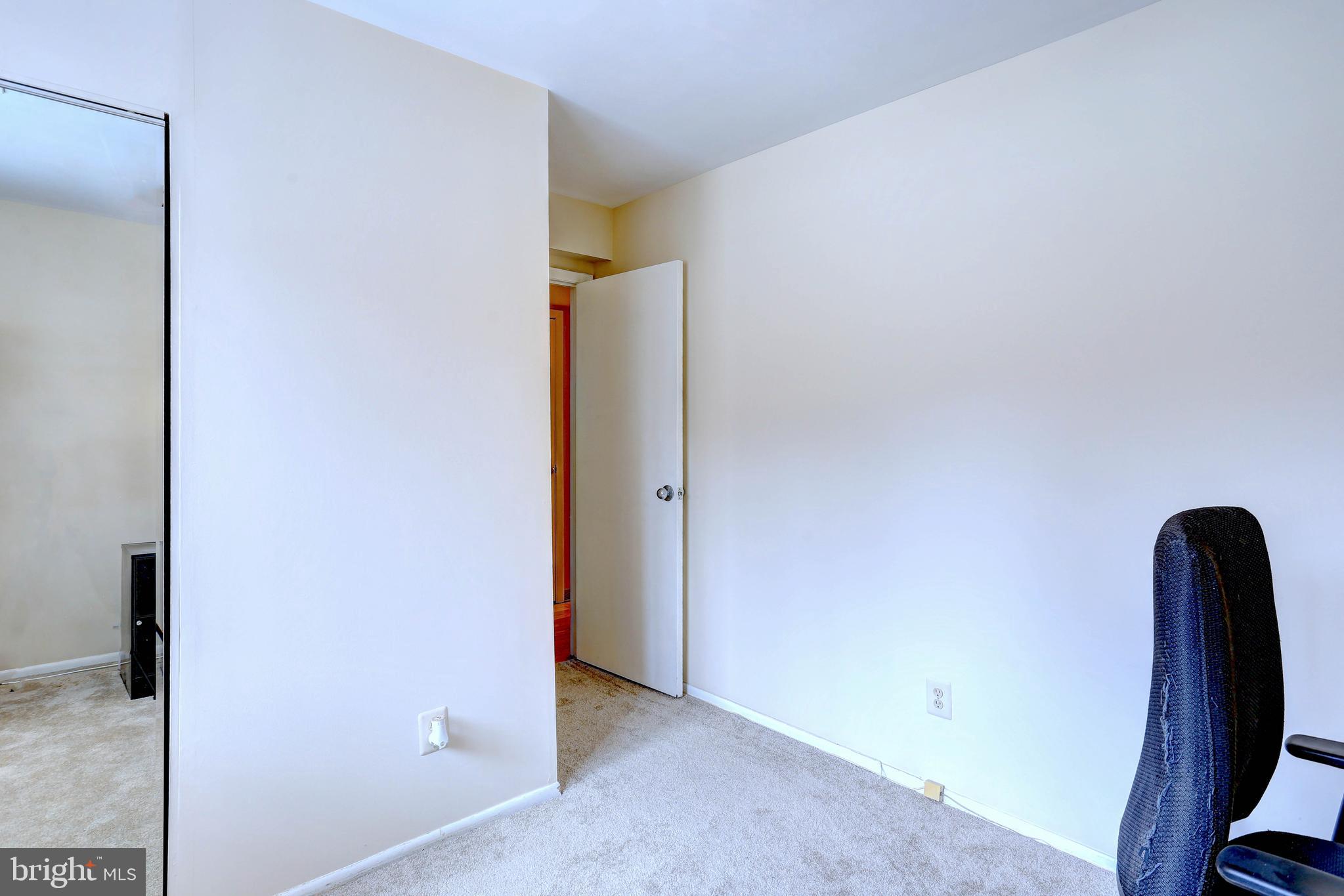 8018 Valley Manor Road, Unit 1A Owings Mills, MD 21117 - Photo 16 of 24 a view of front door with wooden floor