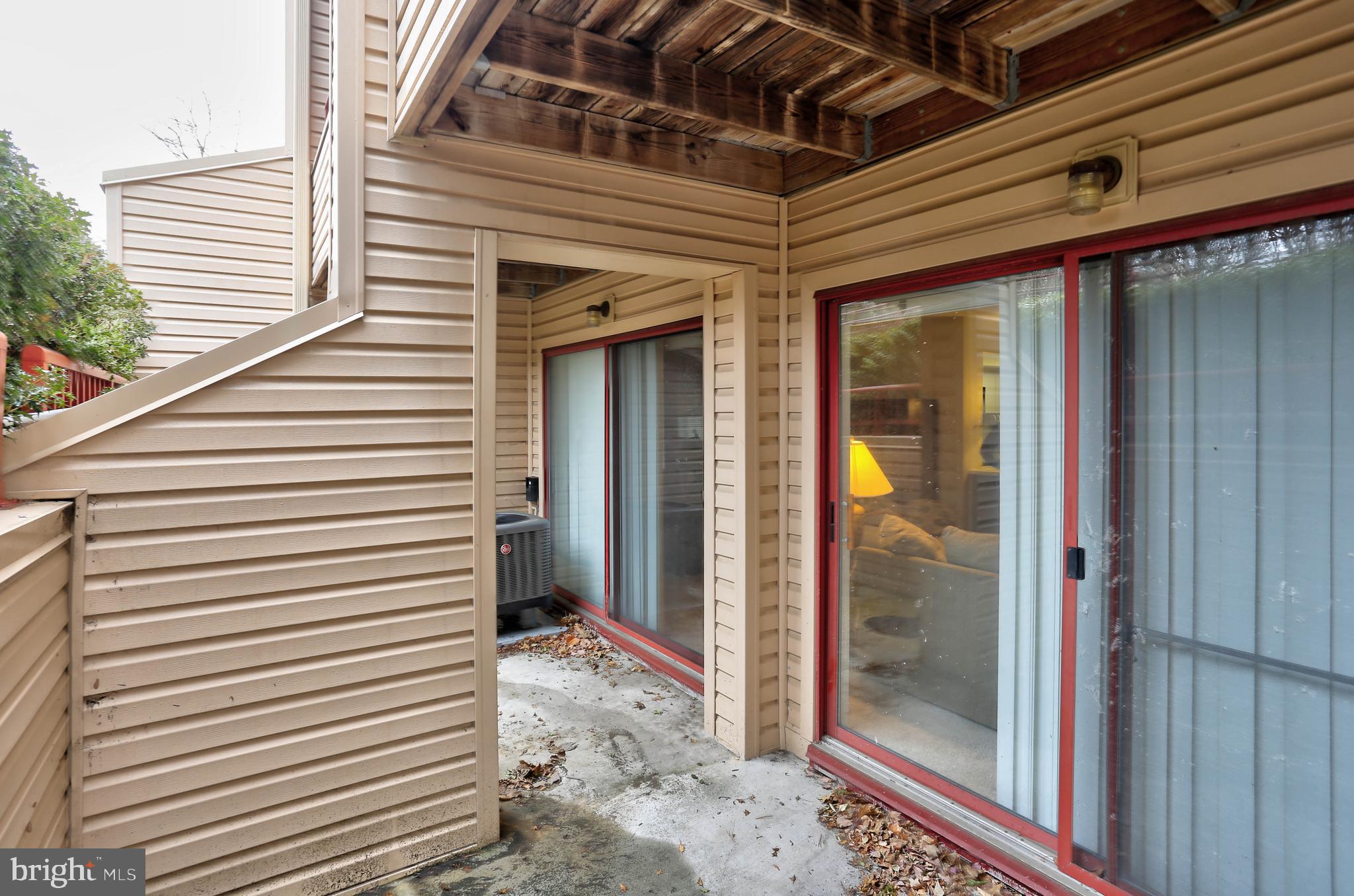 8018 Valley Manor Road, Unit 1A Owings Mills, MD 21117 - Photo 17 of 24 a view of a porch with a door and wooden floor