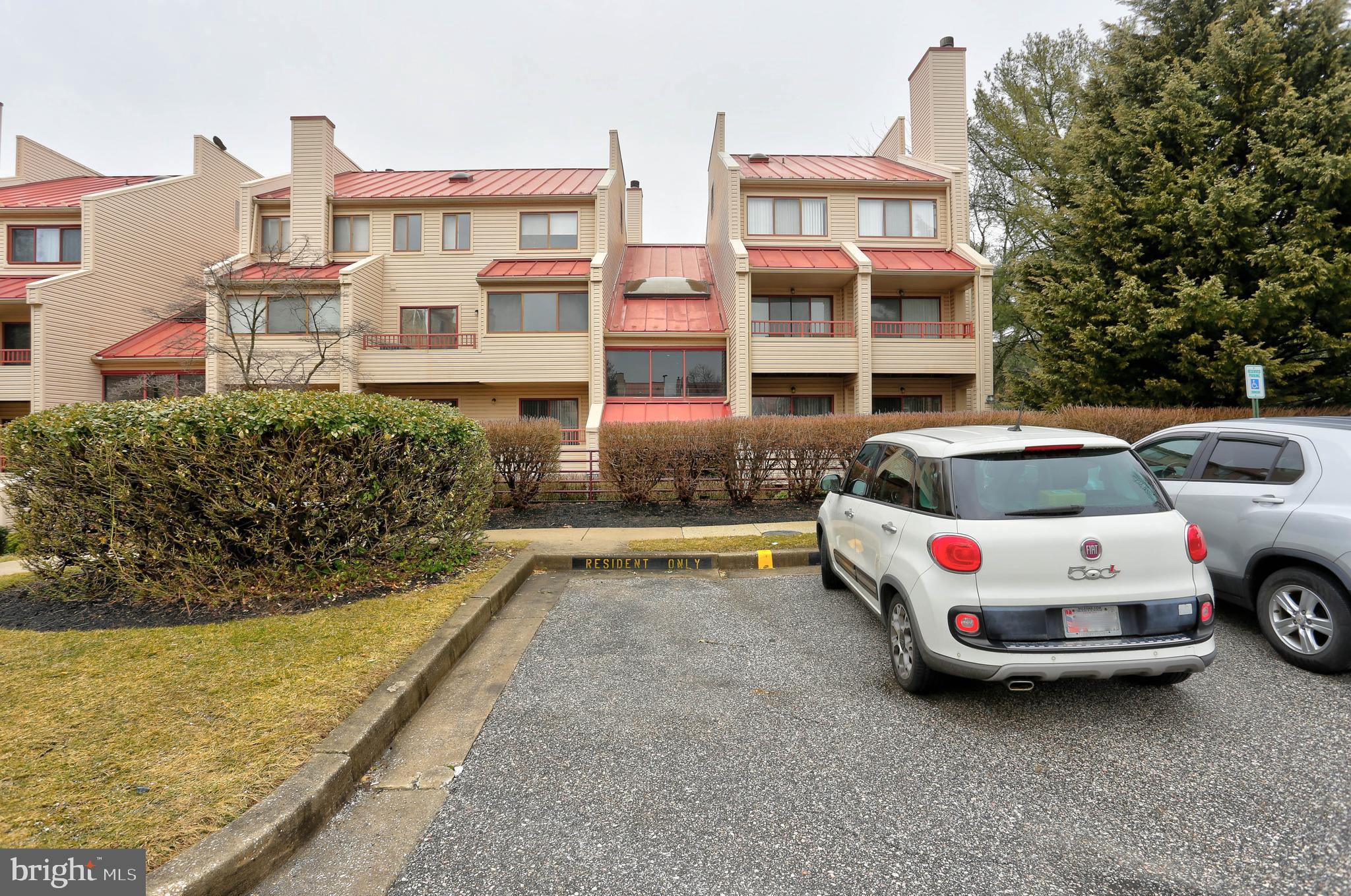 8018 Valley Manor Road, Unit 1A Owings Mills, MD 21117 - Photo 23 of 24 a car parked in front of a white building