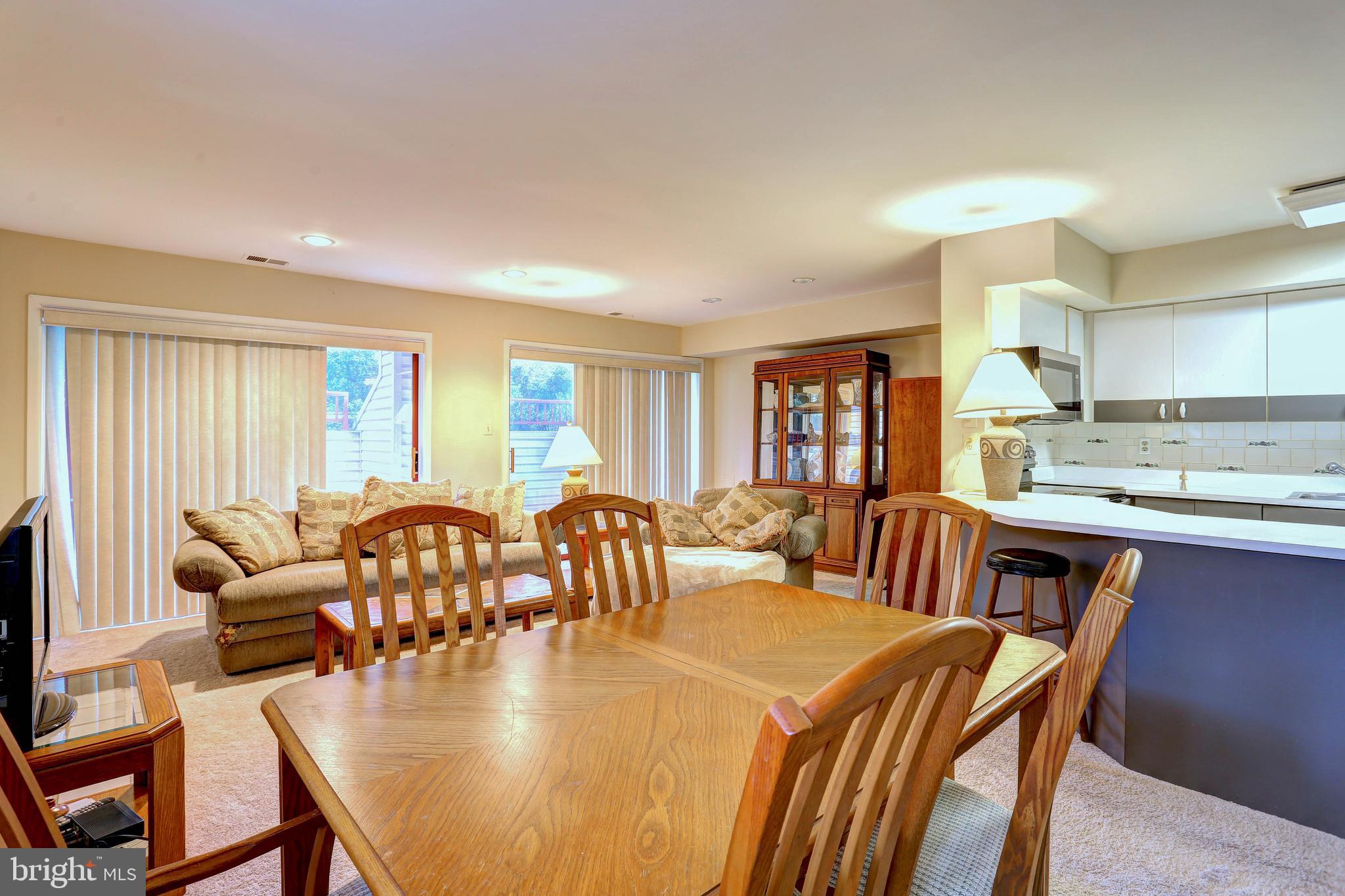 8018 Valley Manor Road, Unit 1A Owings Mills, MD 21117 - Photo 6 of 24 a view of a dining room with furniture window and outside view