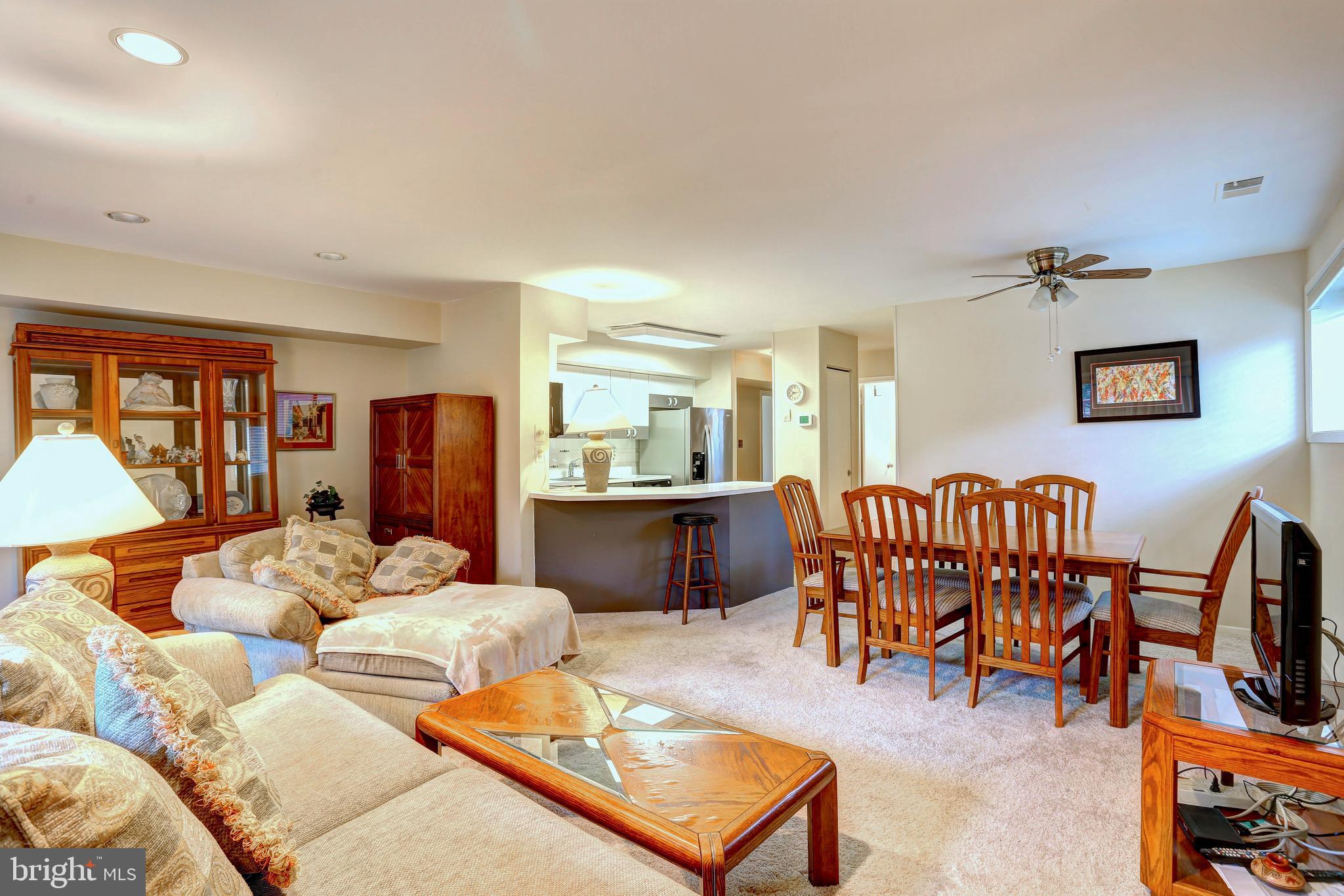 8018 Valley Manor Road, Unit 1A Owings Mills, MD 21117 - Photo 7 of 24 a living room with furniture kitchen view and a large window