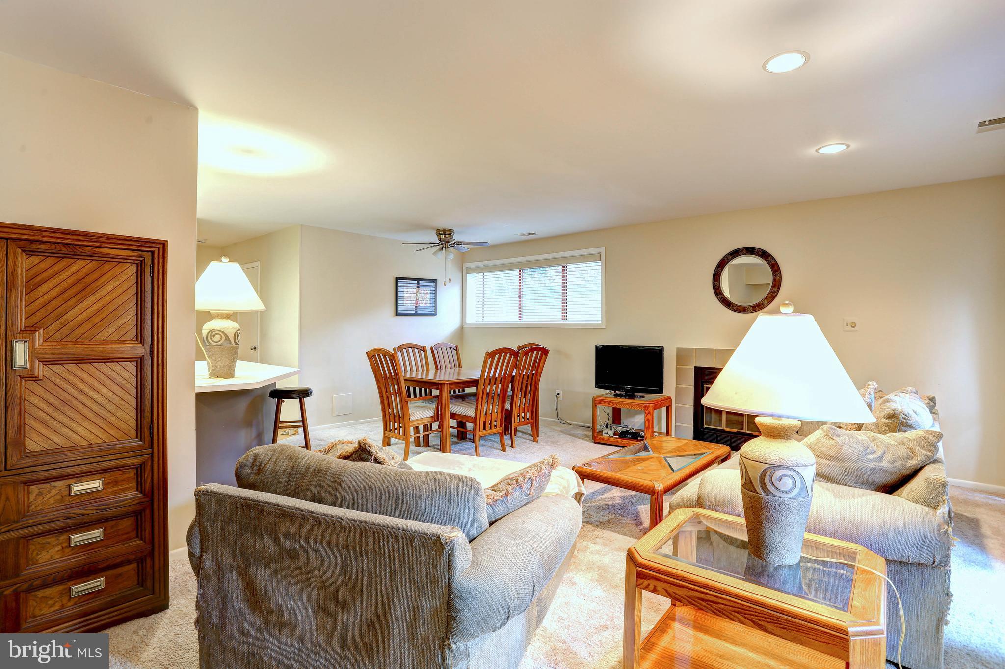 8018 Valley Manor Road, Unit 1A Owings Mills, MD 21117 - Photo 8 of 24 a living room with furniture and a fireplace