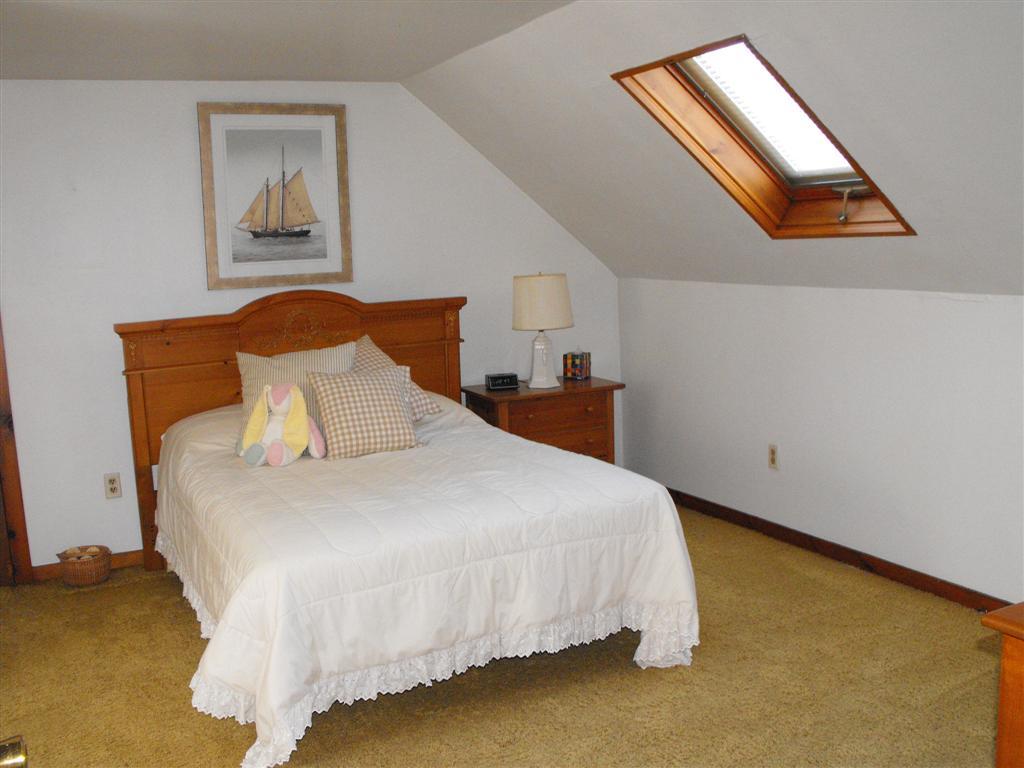 1 West Dale Road Stockbridge, MA 01229 - Photo 18 of 20 a bed sitting in a bedroom next to a window