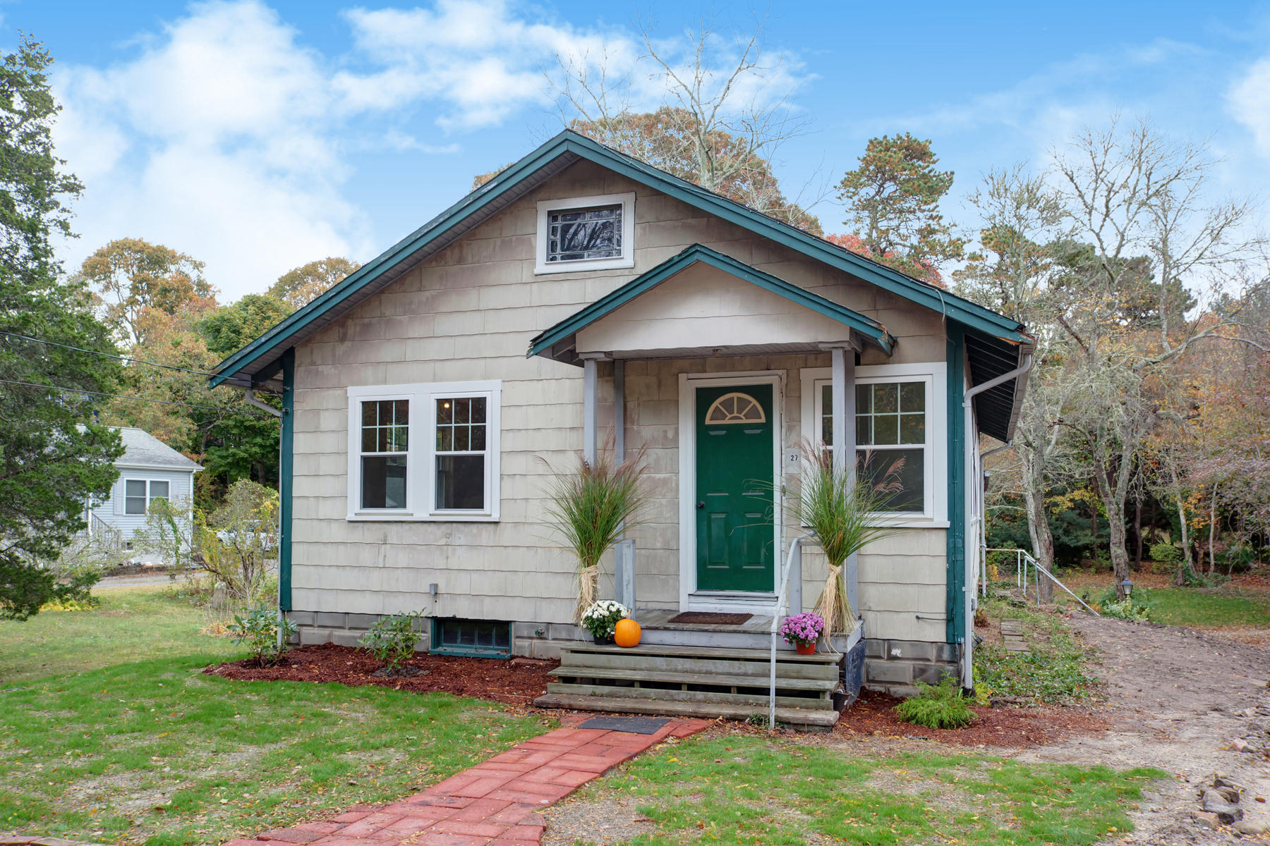 a front view of a house with a yard