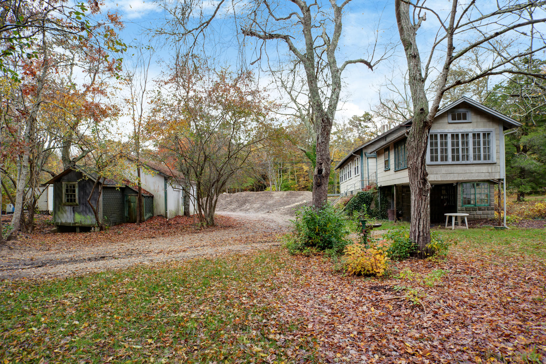 27 County Road Monument Beach, MA 02532 - Photo 17 of 17 a front view of a house with a yard and large trees
