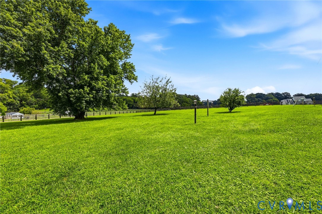 1108 Schroeder Road Powhatan, VA 23139 - Photo 14 of 33 Expansive verdant lawn with mature trees and a per