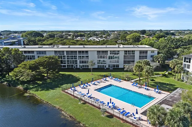 a view of a big room with a big yard and potted plants