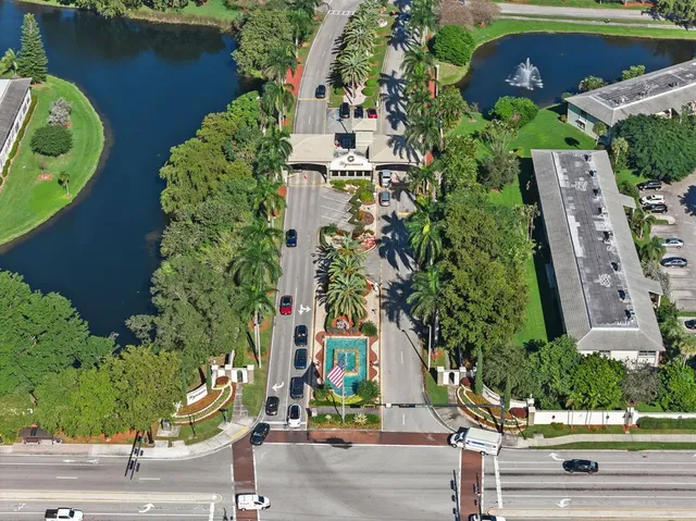an aerial view of a house with outdoor space and street view