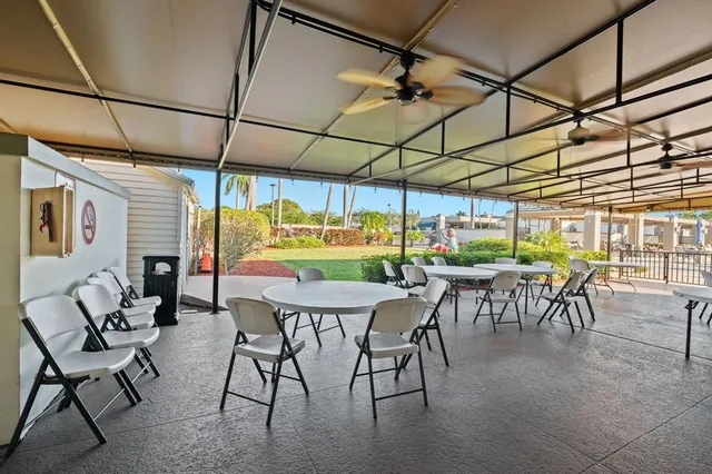 a view of a dining area with furniture and a window