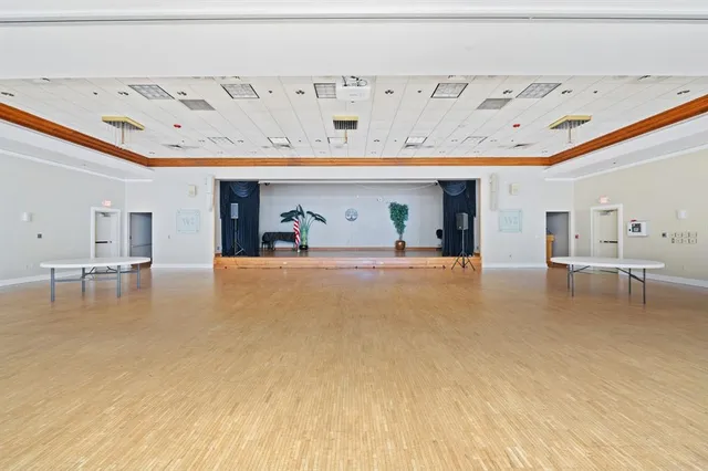 a living room with furniture a table and chairs