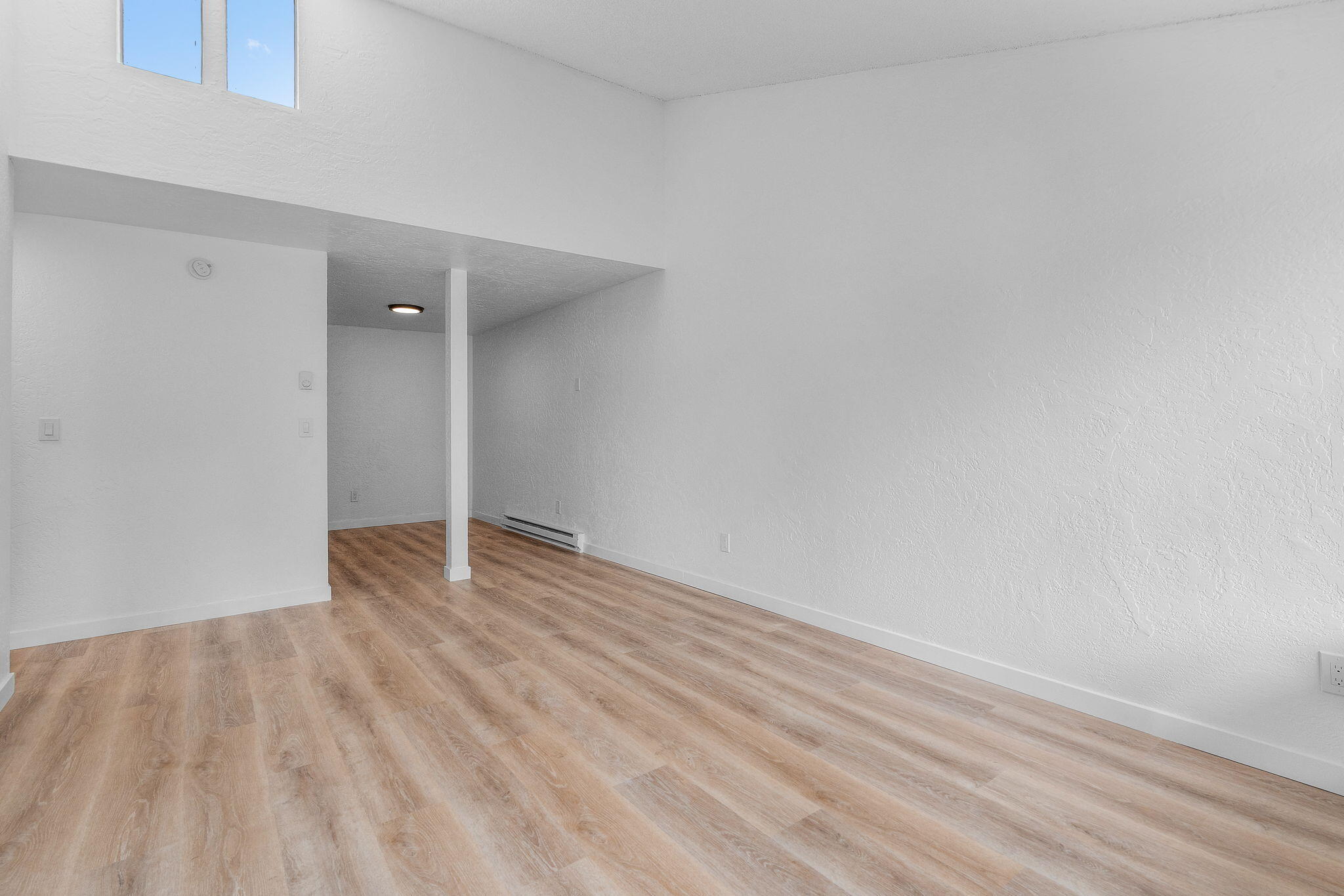 1700 Northeast Wells Acres Road, Unit 25 Bend, OR 97701 - Photo 6 of 25 a view of an empty room with wooden floor