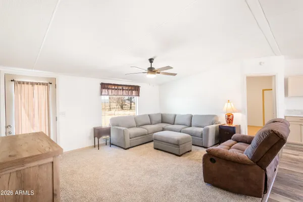 a living room with furniture and a large window