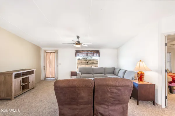 a living room with furniture and a window