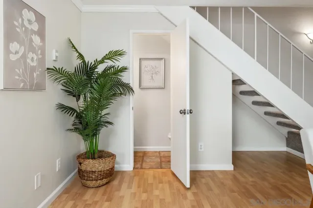 a view of an entryway with wooden floor