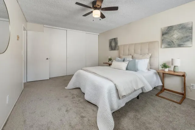 a bedroom with a bed and window
