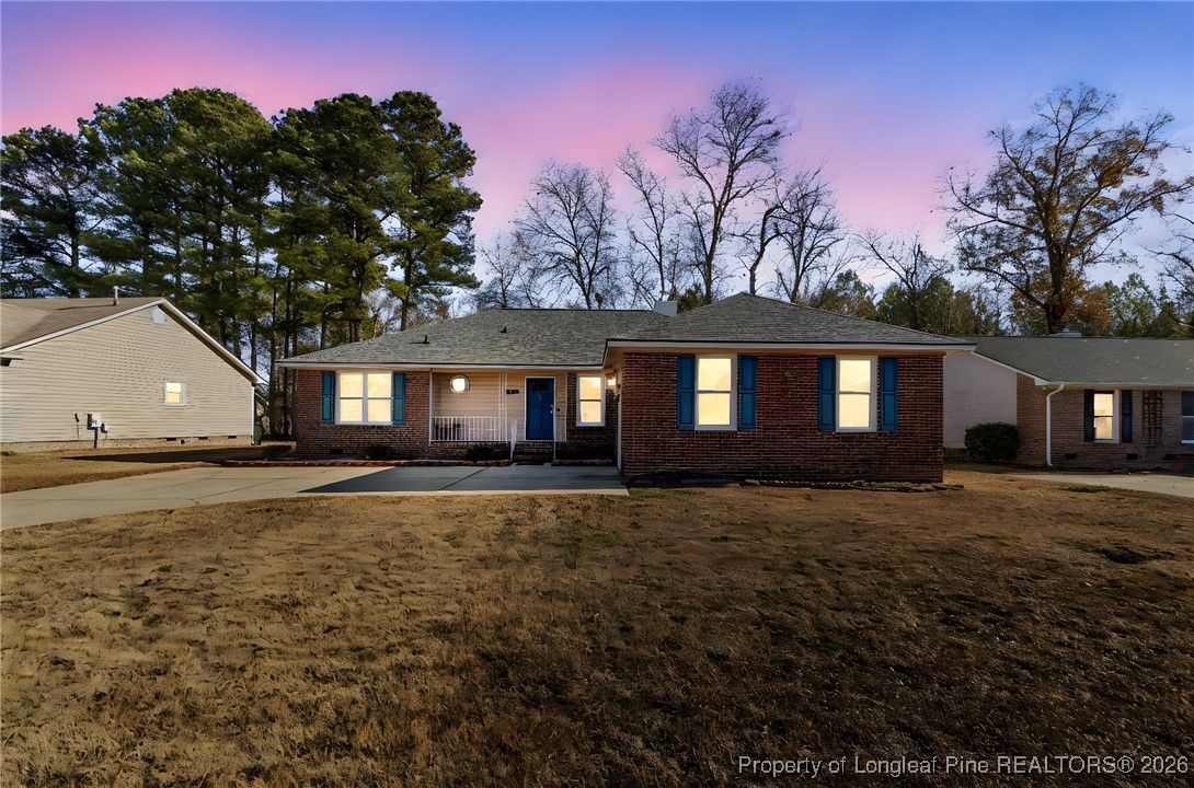 921 Flintwood Road Fayetteville, NC 28314 - Photo 1 of 44 a front view of a house with yard and trees
