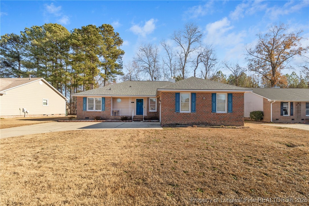921 Flintwood Road Fayetteville, NC 28314 - Photo 2 of 44 a front view of a house with a yard