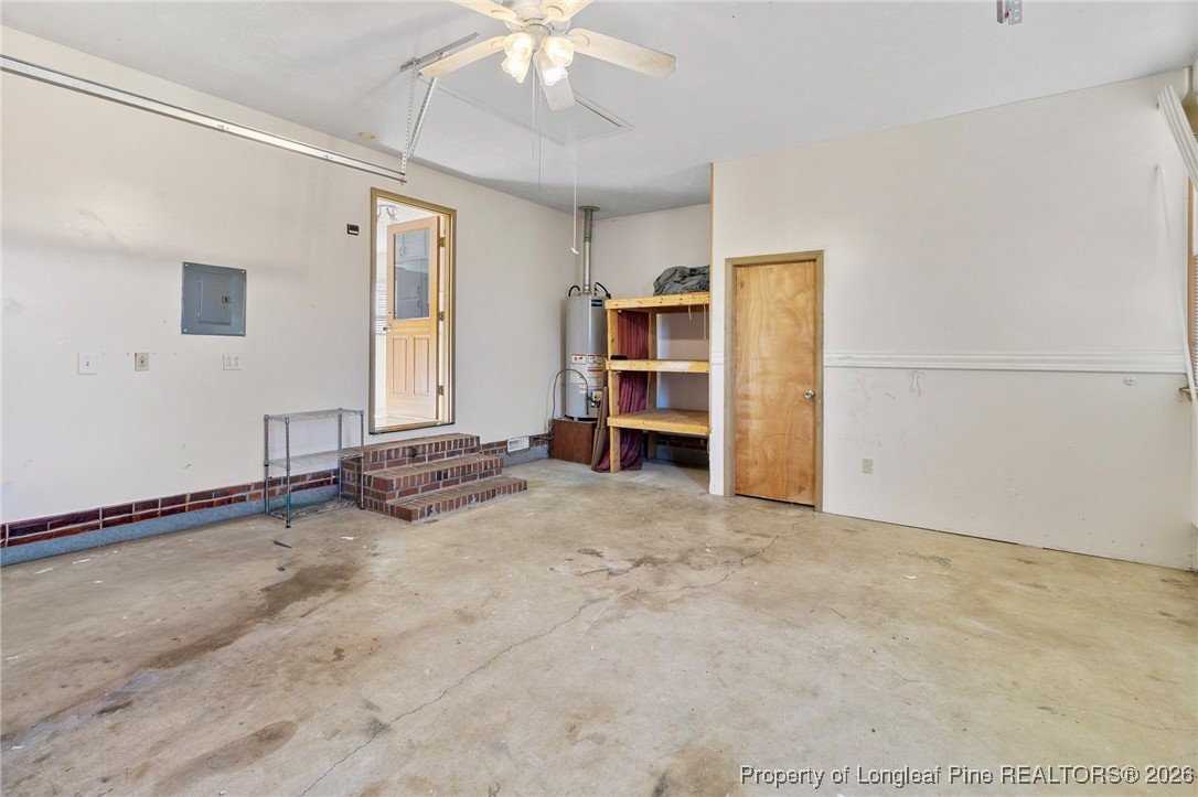 921 Flintwood Road Fayetteville, NC 28314 - Photo 21 of 44 an empty room with a fireplace and cabinet