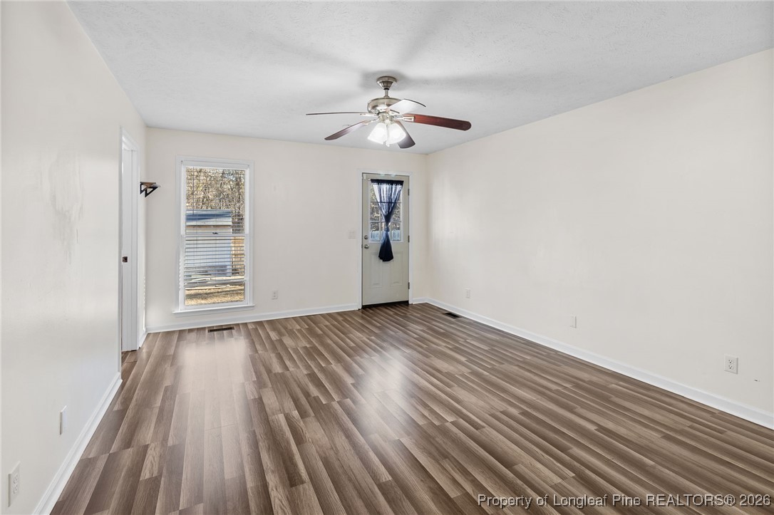 921 Flintwood Road Fayetteville, NC 28314 - Photo 25 of 44 wooden floor in an empty room with a window