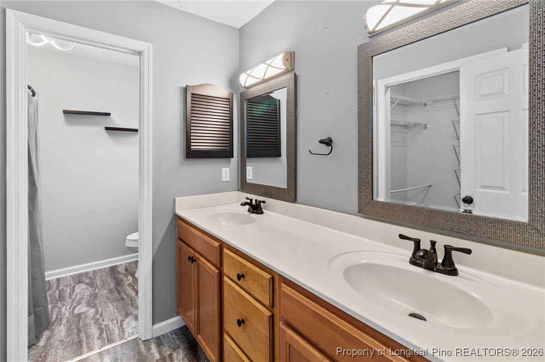 921 Flintwood Road Fayetteville, NC 28314 - Photo 27 of 44 a bathroom with a sink and a mirror