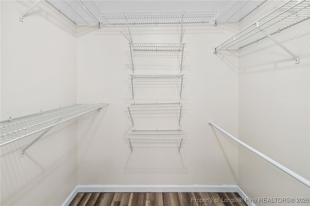 921 Flintwood Road Fayetteville, NC 28314 - Photo 28 of 44 a view of walk in closet with empty racks