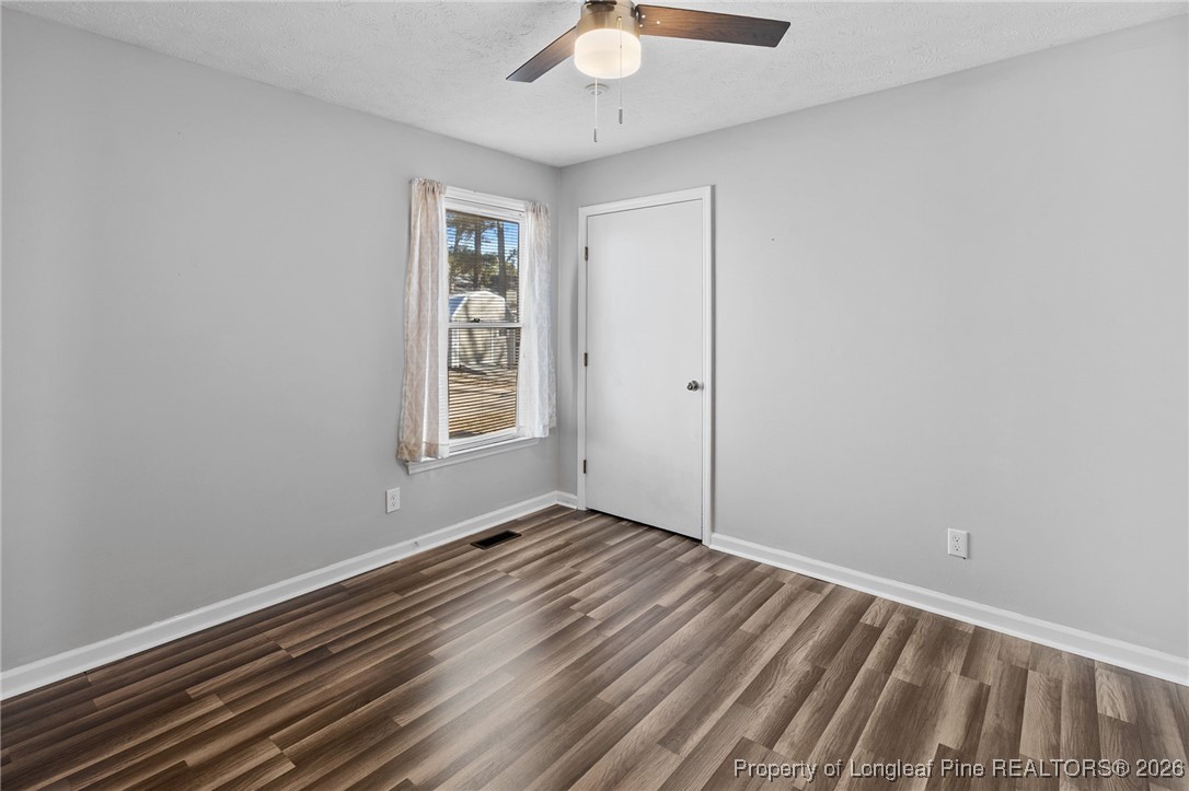 921 Flintwood Road Fayetteville, NC 28314 - Photo 31 of 44 wooden floor in an empty room with a window