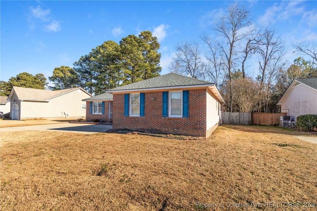 921 Flintwood Road Fayetteville, NC 28314 - Photo 4 of 44 a house with trees in front of it
