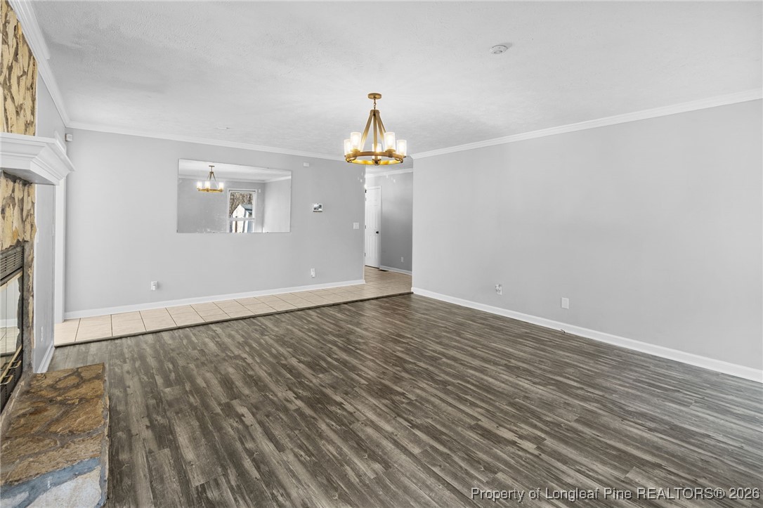 921 Flintwood Road Fayetteville, NC 28314 - Photo 10 of 44 wooden floor in an empty room with a window