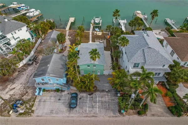 an aerial view of houses with outdoor space