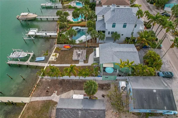 an aerial view of a house with a lake view