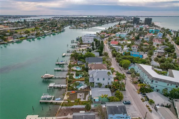 an aerial view of a city and lake view
