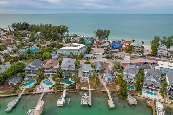 an aerial view of a house with a ocean view