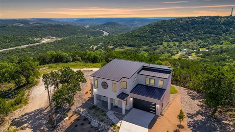 an aerial view of a house with a garden