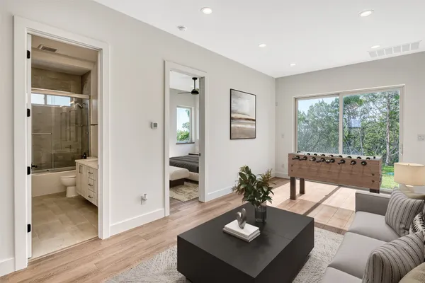 a living room with furniture and a large window