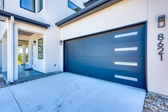 a view of an empty room and a window