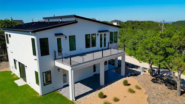 an aerial view of a house with a garden