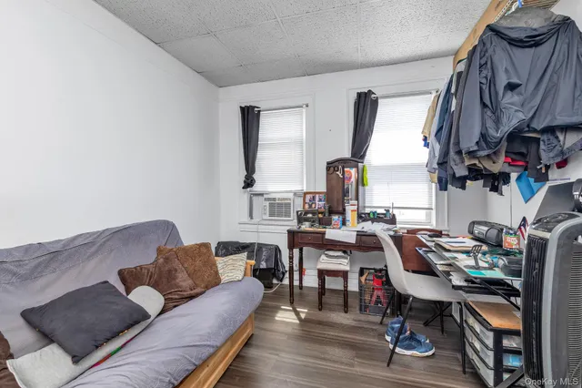 a view of a livingroom with furniture and a potted plant