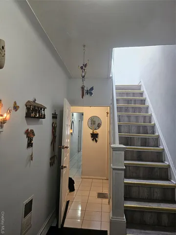a view of staircase with white walls