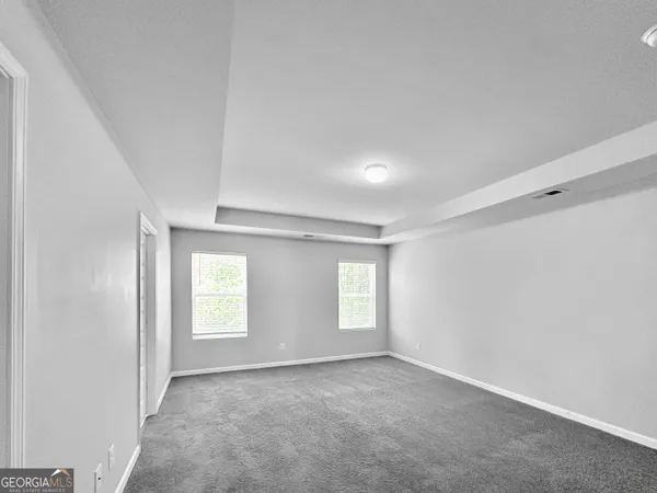 a view of empty room with windows