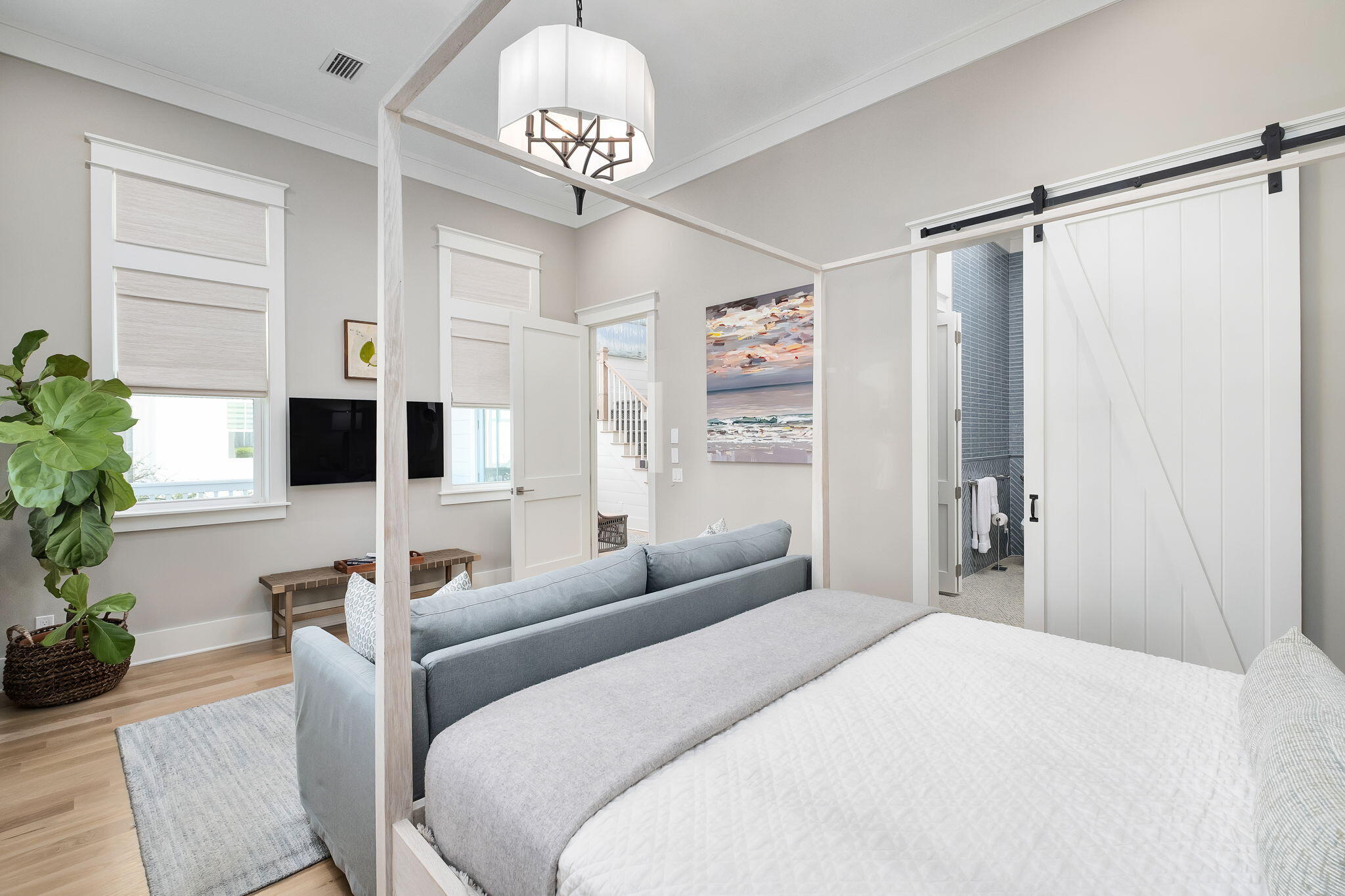 194 Sawbuck Dr Inlet Beach Inlet Beach, FL 32461 - Photo 11 of 38 a bedroom with a large bed and a chandelier