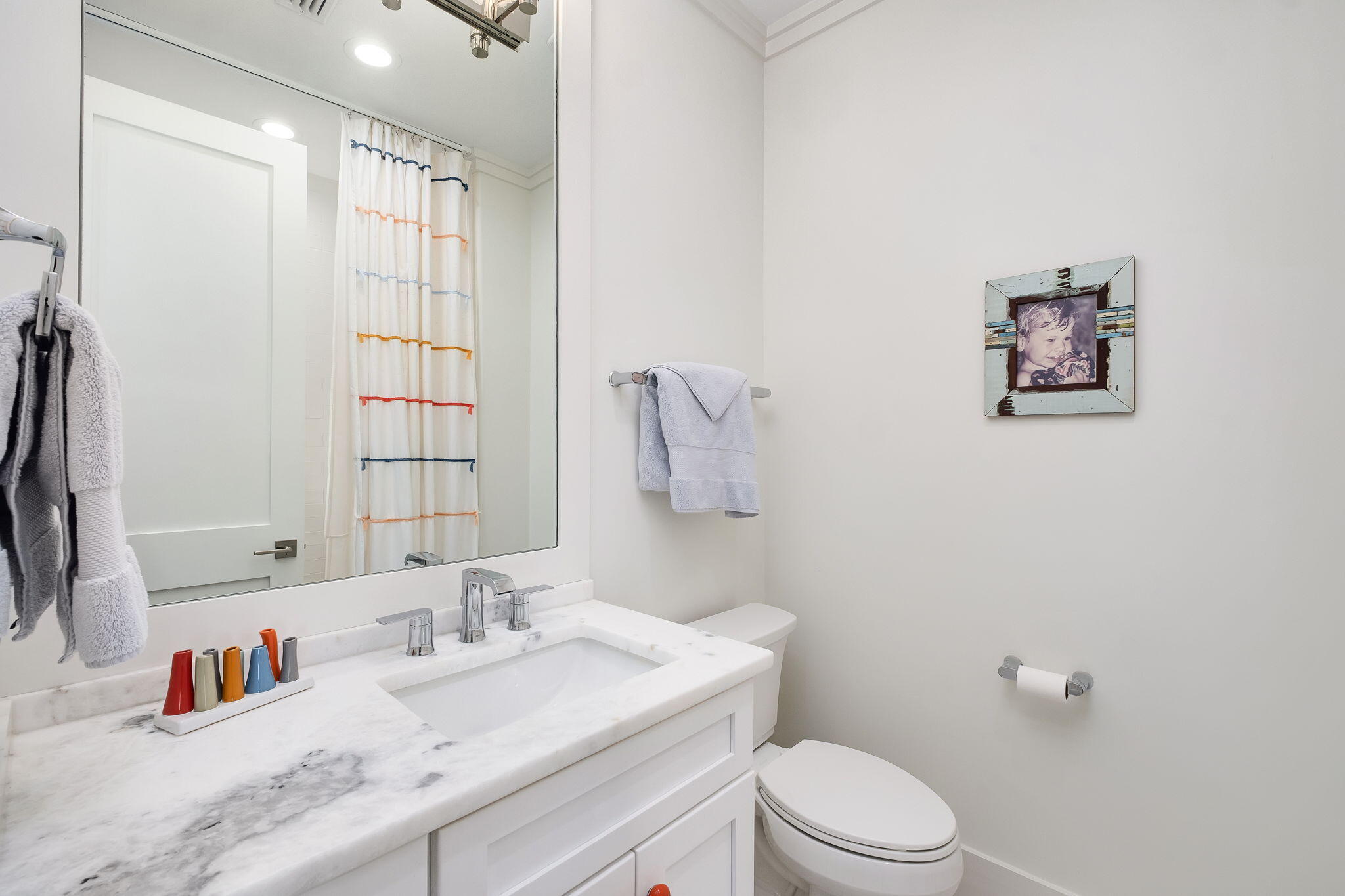 194 Sawbuck Dr Inlet Beach Inlet Beach, FL 32461 - Photo 18 of 38 a bathroom with a granite countertop sink mirror vanity and toilet