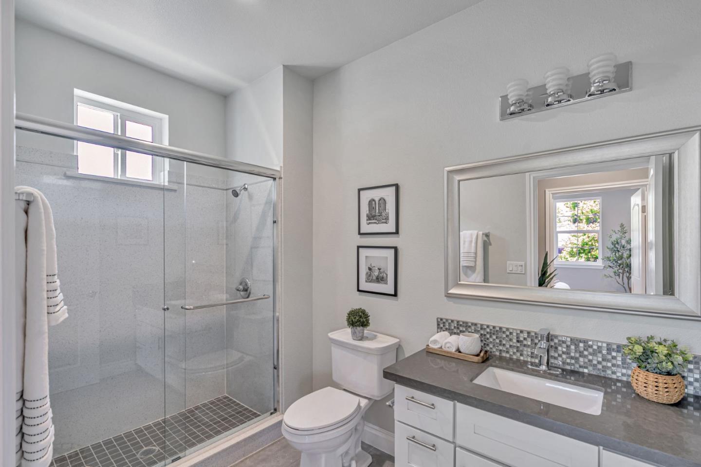 24757 Oneil Avenue Hayward, CA 94544 - Photo 13 of 17 a bathroom with a granite countertop sink a toilet a mirror and shower