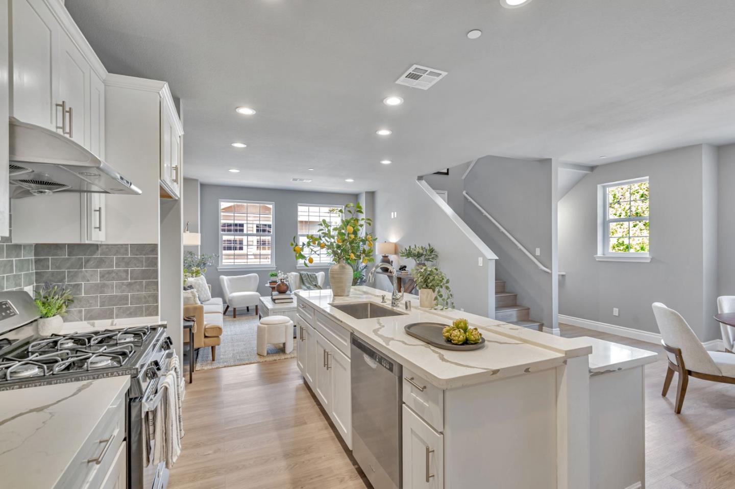 24757 Oneil Avenue Hayward, CA 94544 - Photo 2 of 17 a kitchen that has a lot of cabinets a sink and wooden floor