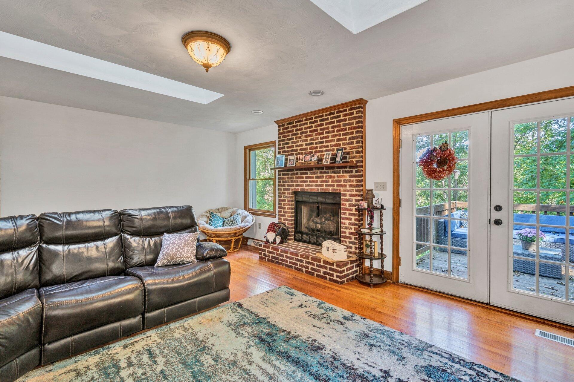 1842 Morris Road Goodview, VA 24095 - Photo 14 of 35 a living room with furniture and a fireplace