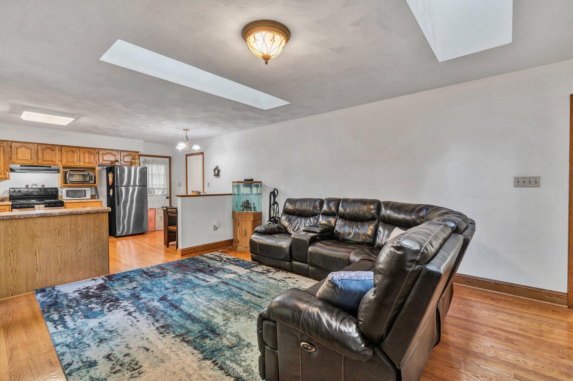1842 Morris Road Goodview, VA 24095 - Photo 15 of 35 a living room with furniture and a wooden floor