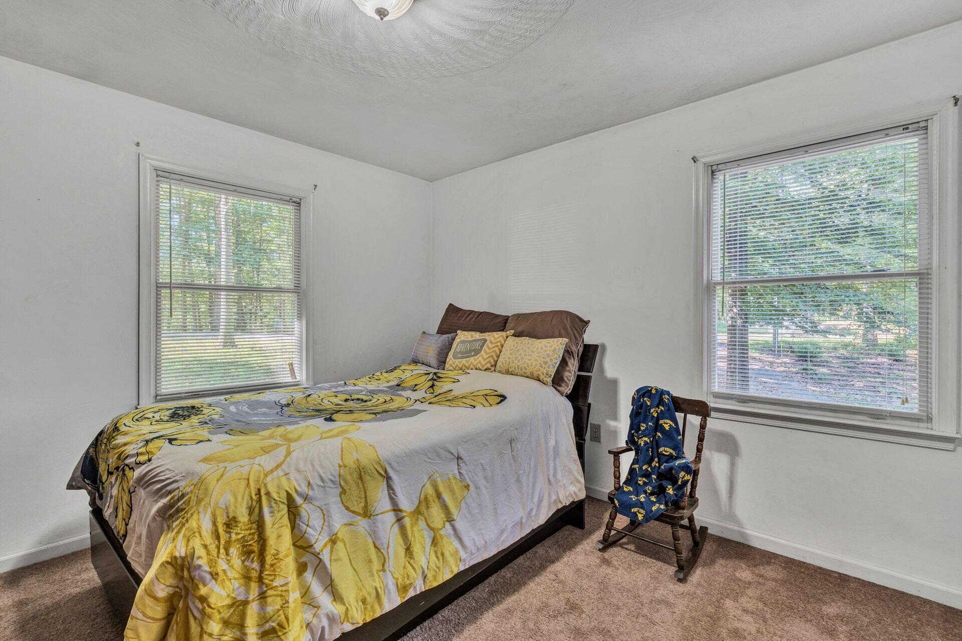 1842 Morris Road Goodview, VA 24095 - Photo 23 of 35 a bedroom with a bed and a window