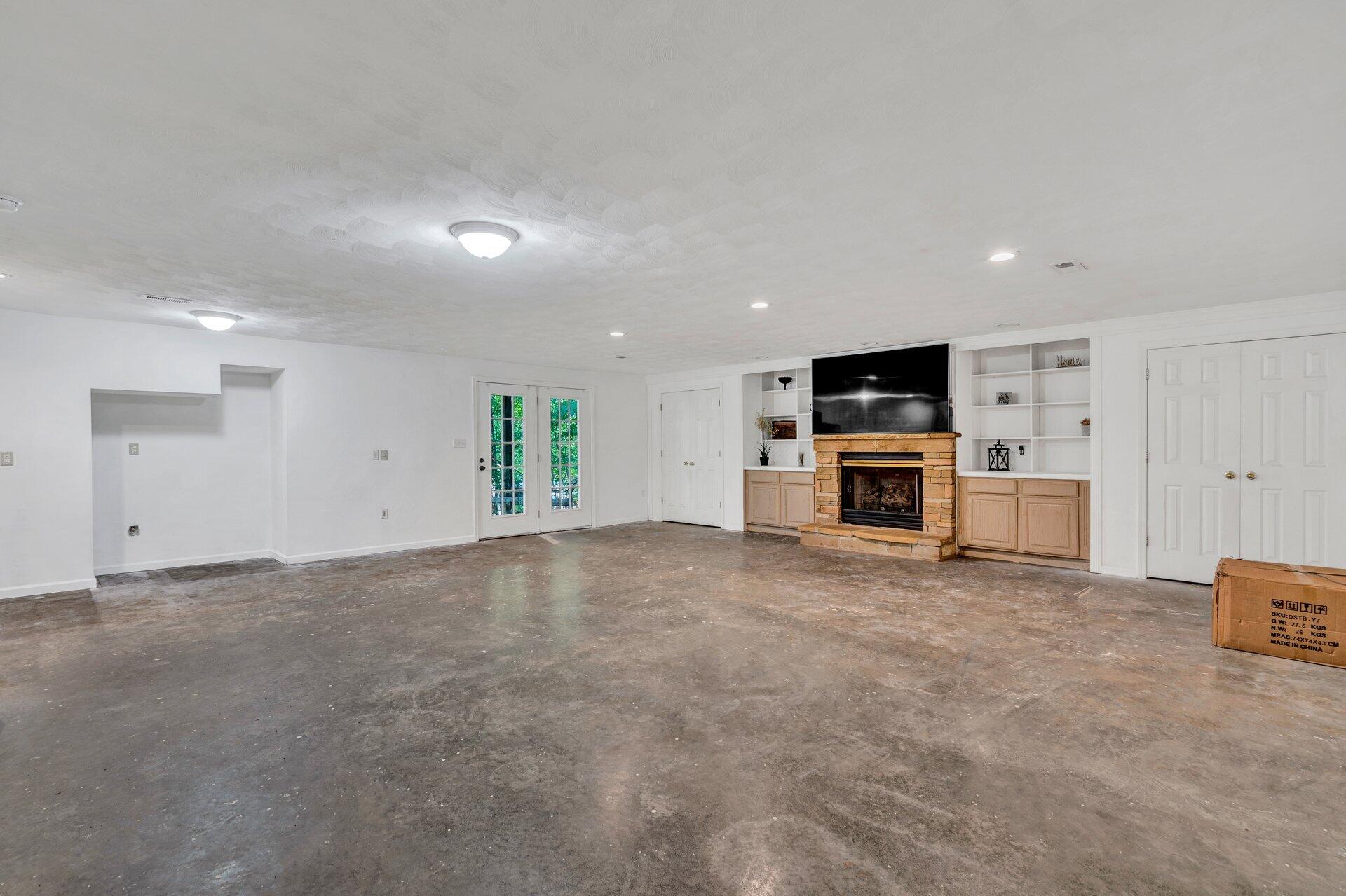 1842 Morris Road Goodview, VA 24095 - Photo 25 of 35 a view of a livingroom with kitchen and fireplace