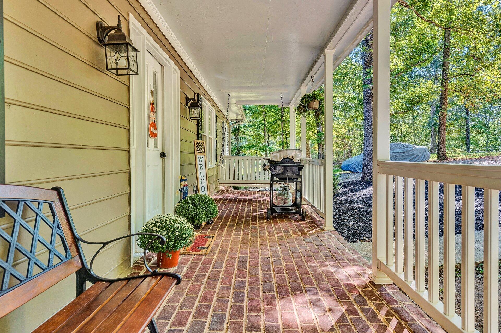 1842 Morris Road Goodview, VA 24095 - Photo 4 of 35 a view of balcony with chairs and wooden floor