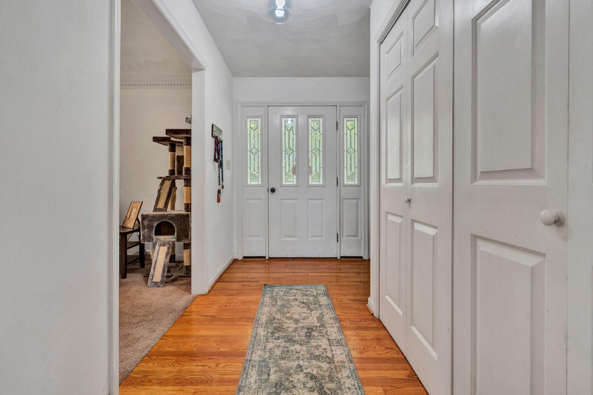 1842 Morris Road Goodview, VA 24095 - Photo 5 of 35 a view of a hallway with wooden floor and closet